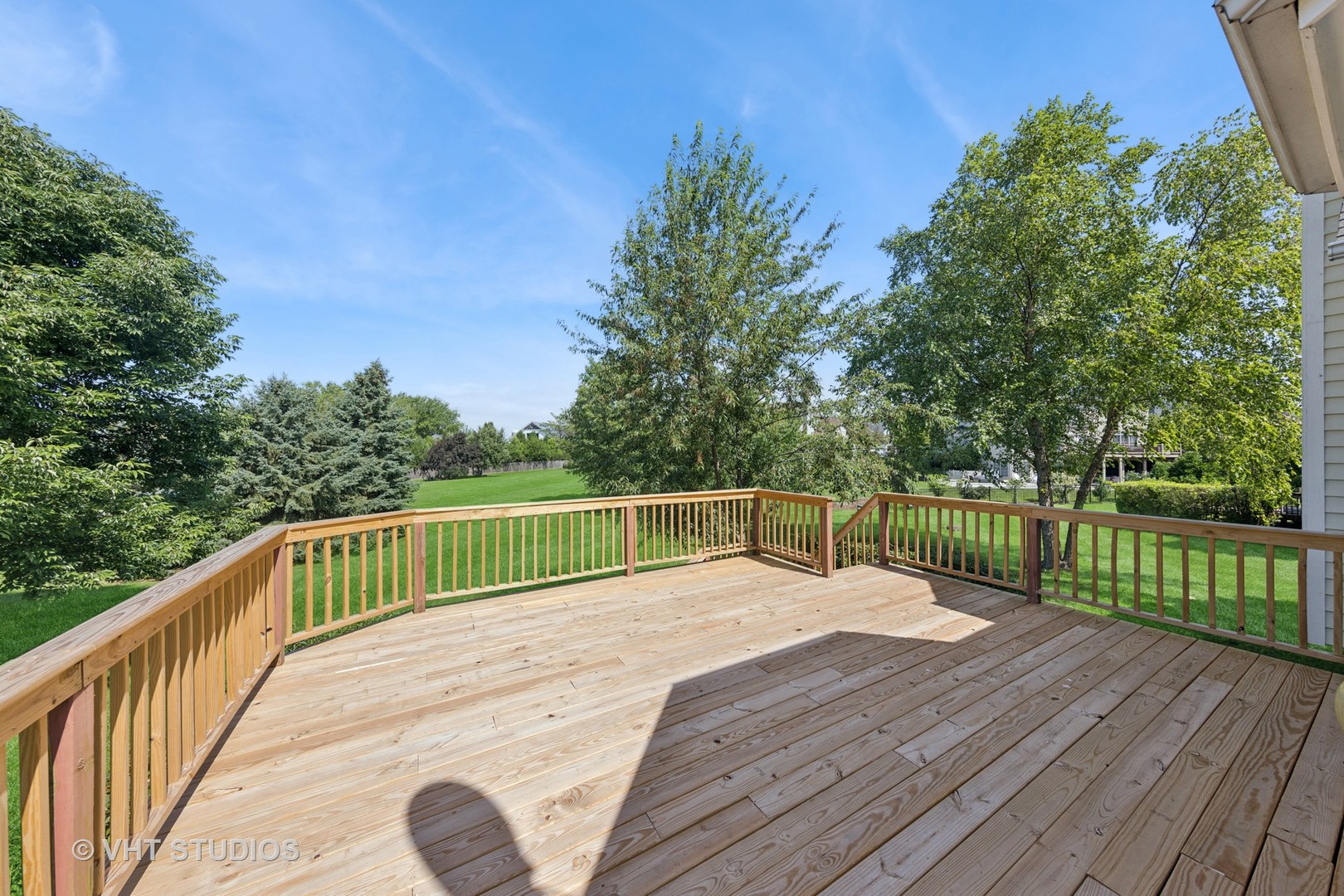 12804 Stellar Lane Plainfield, IL 60585 - Photo 32 of 37 a view of balcony with wooden floor and fence