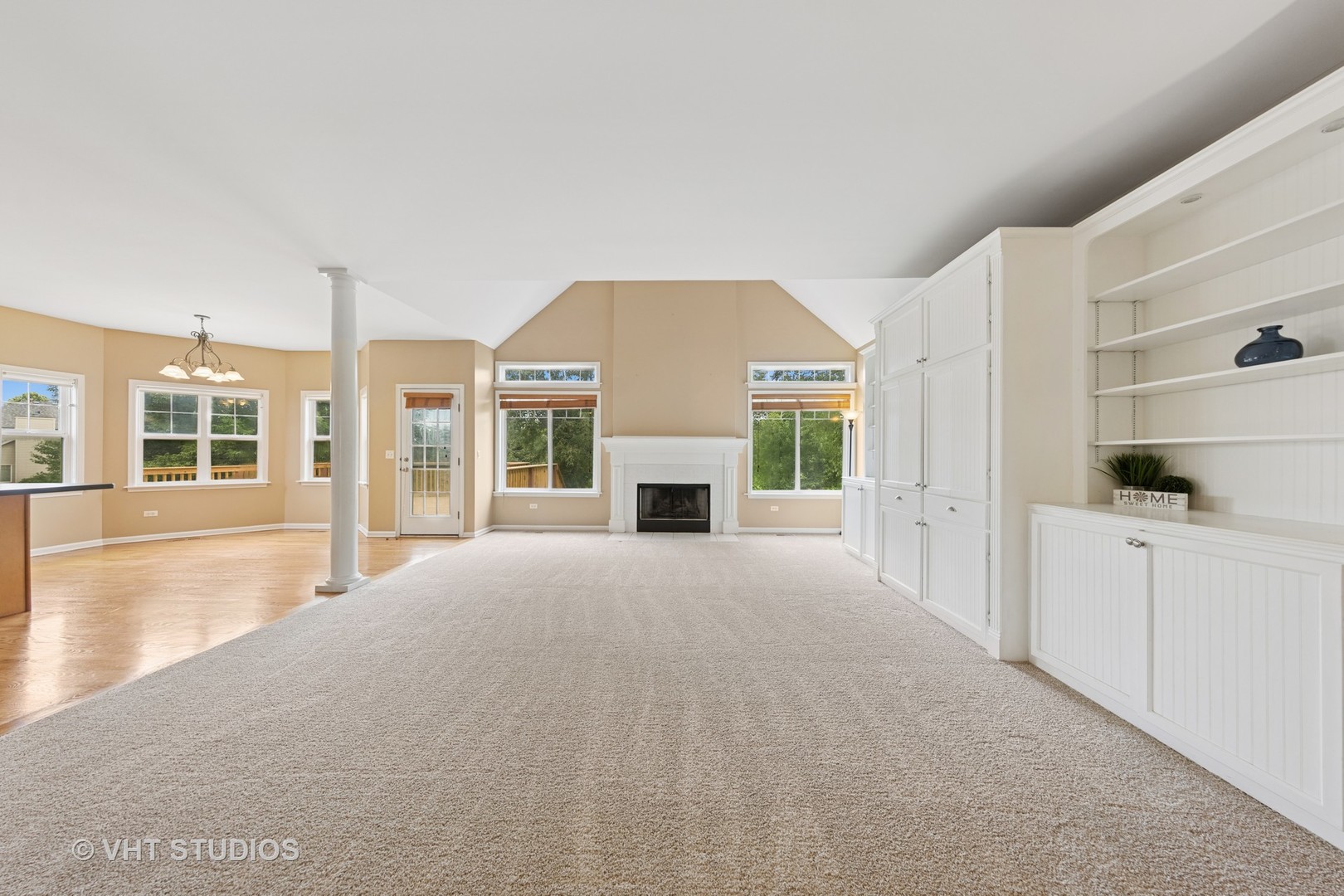 12804 Stellar Lane Plainfield, IL 60585 - Photo 10 of 37 a view of an empty room with window and kitchen view