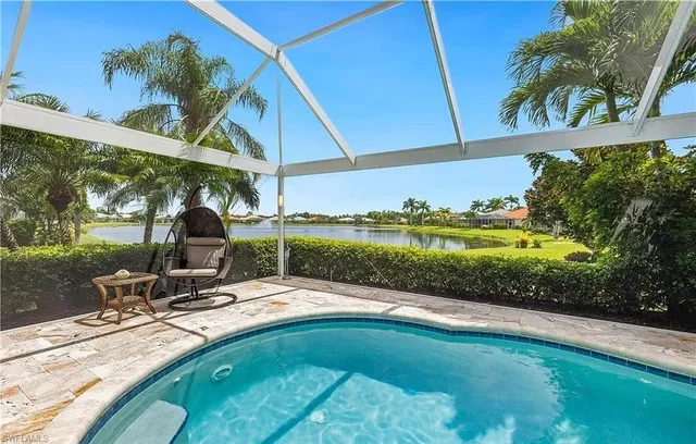 a view of a swimming pool with a patio