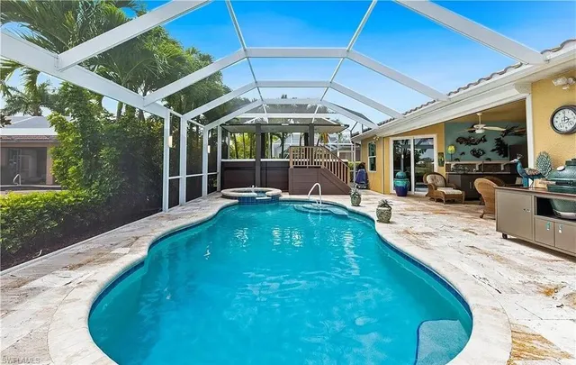 a view of a swimming pool with a patio