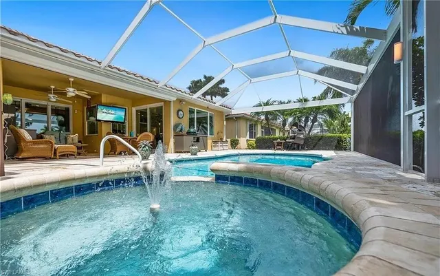 a view of a swimming pool with a patio