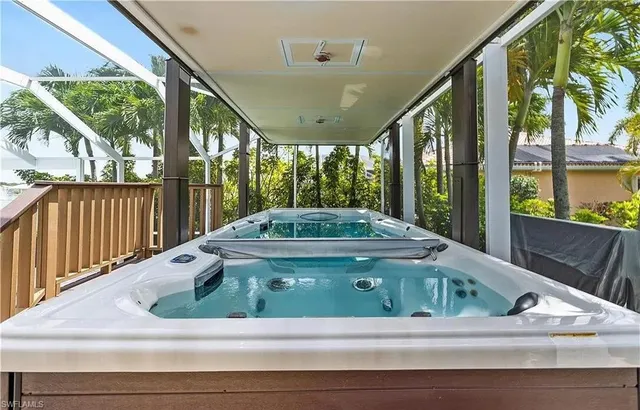 a view of swimming pool with porch and furniture