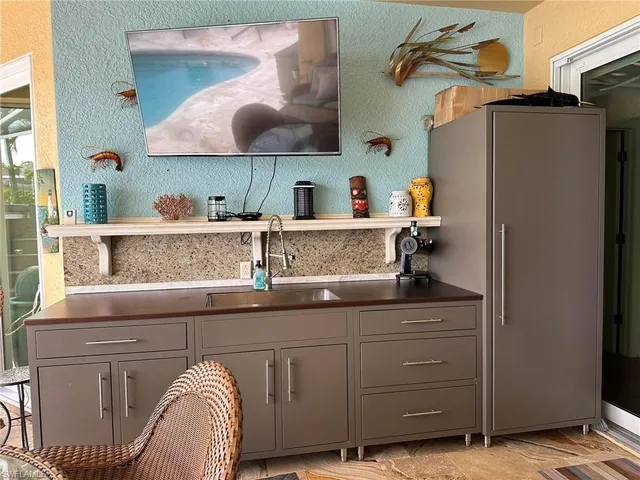 a kitchen with a sink and cabinets
