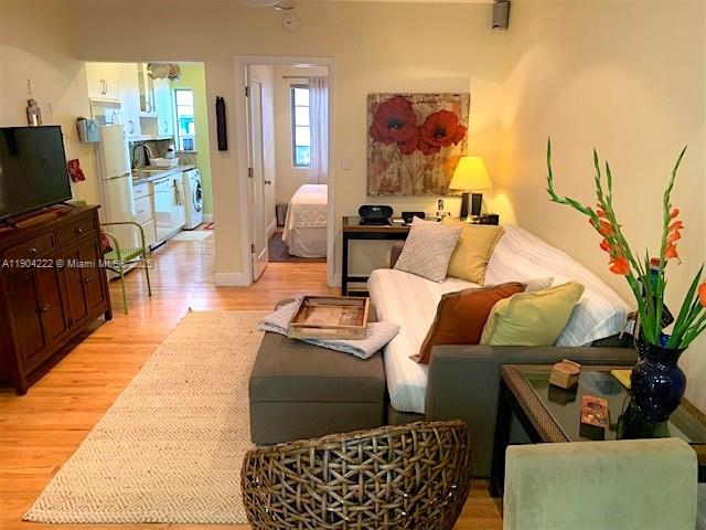 744 Lenox Avenue, Unit 3 Miami Beach, FL 33139 - Photo 11 of 13 a living room with furniture and a flat screen tv