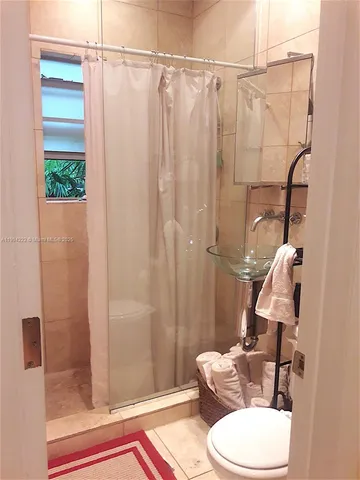 a bathroom with a shower curtain
