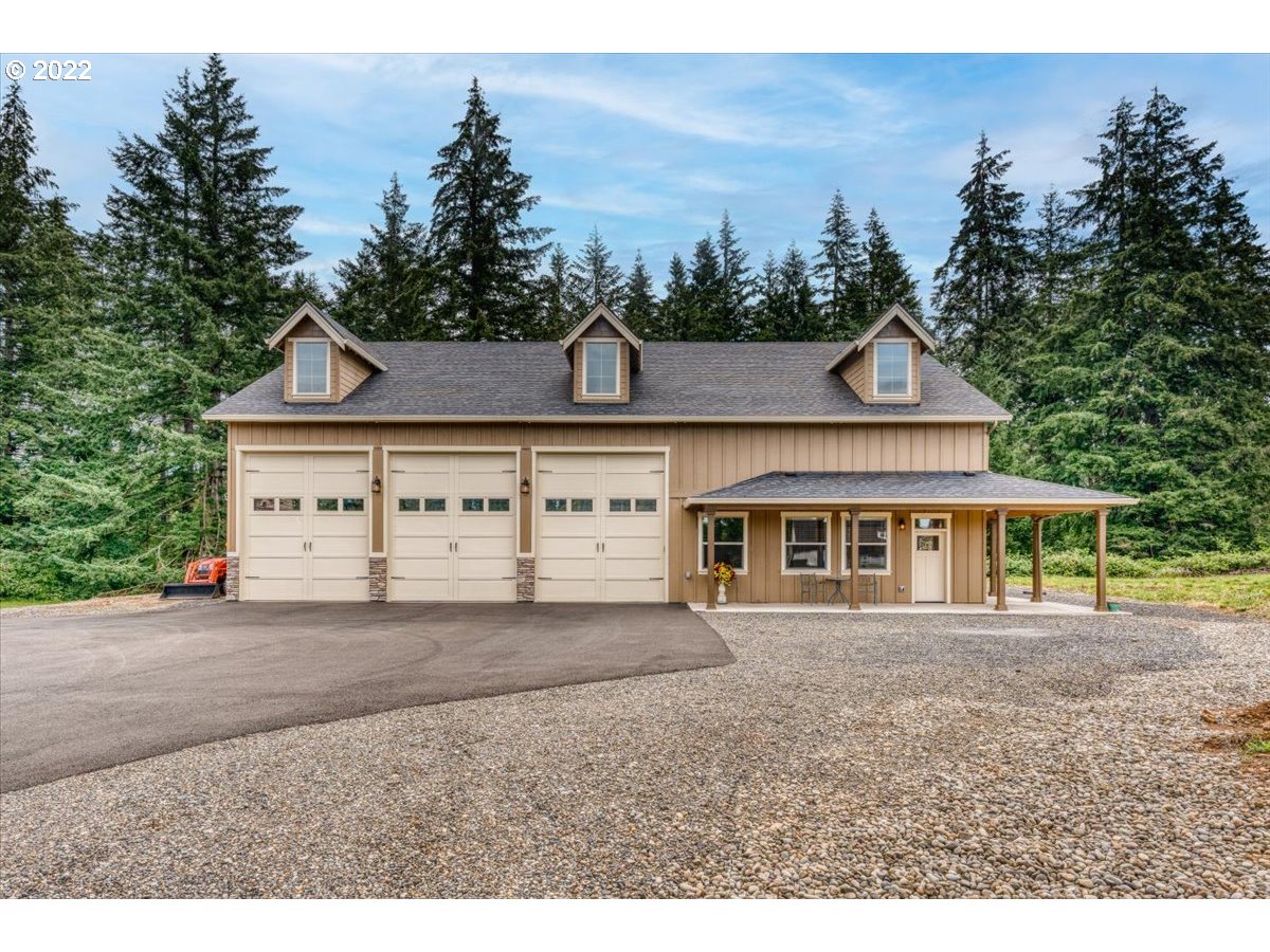18809 South Kimball Road Oregon City, OR 97045 - Photo 22 of 32 a front view of a house with a garden