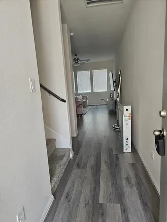 wooden floor in an empty room with a fireplace