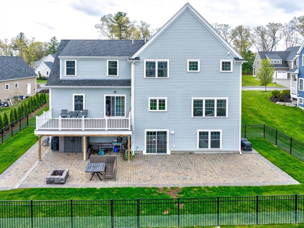 51 Tamarack Road Dracut, MA 01826 - Photo 34 of 39 a front view of a house with garden and porch