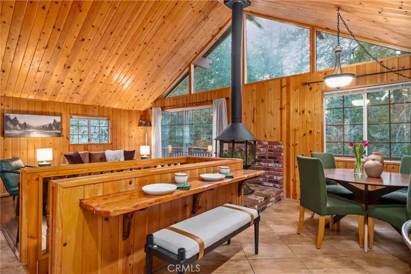 a dining room with furniture and a chandelier