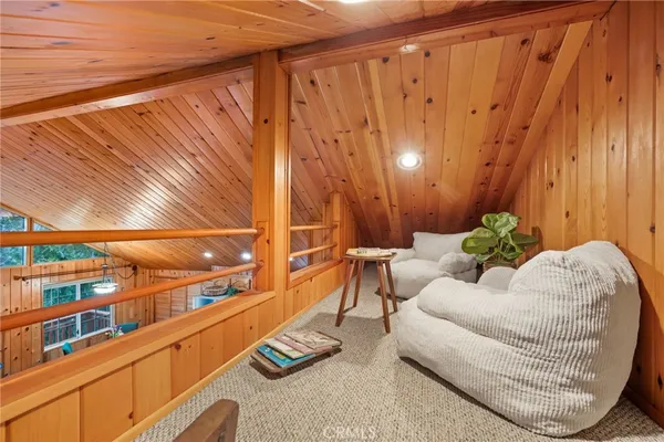 a bed room with a bed and a chair