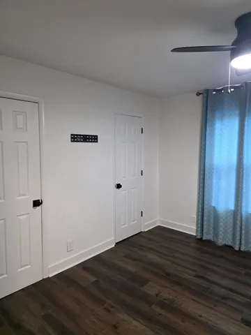 a view of wooden floor and brick wall