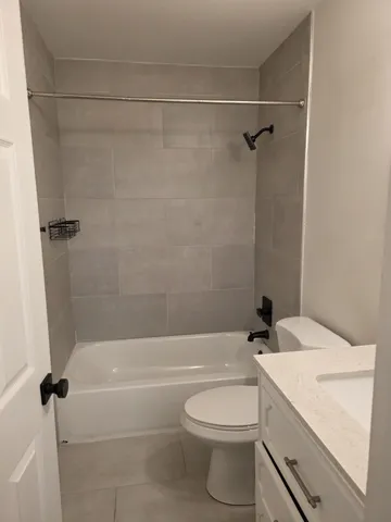 a bathroom with a sink a toilet and a bathtub