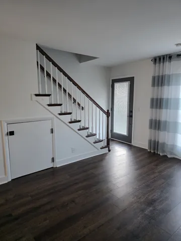 a view of entryway with wooden floor