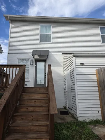 a front view of a house with stairs