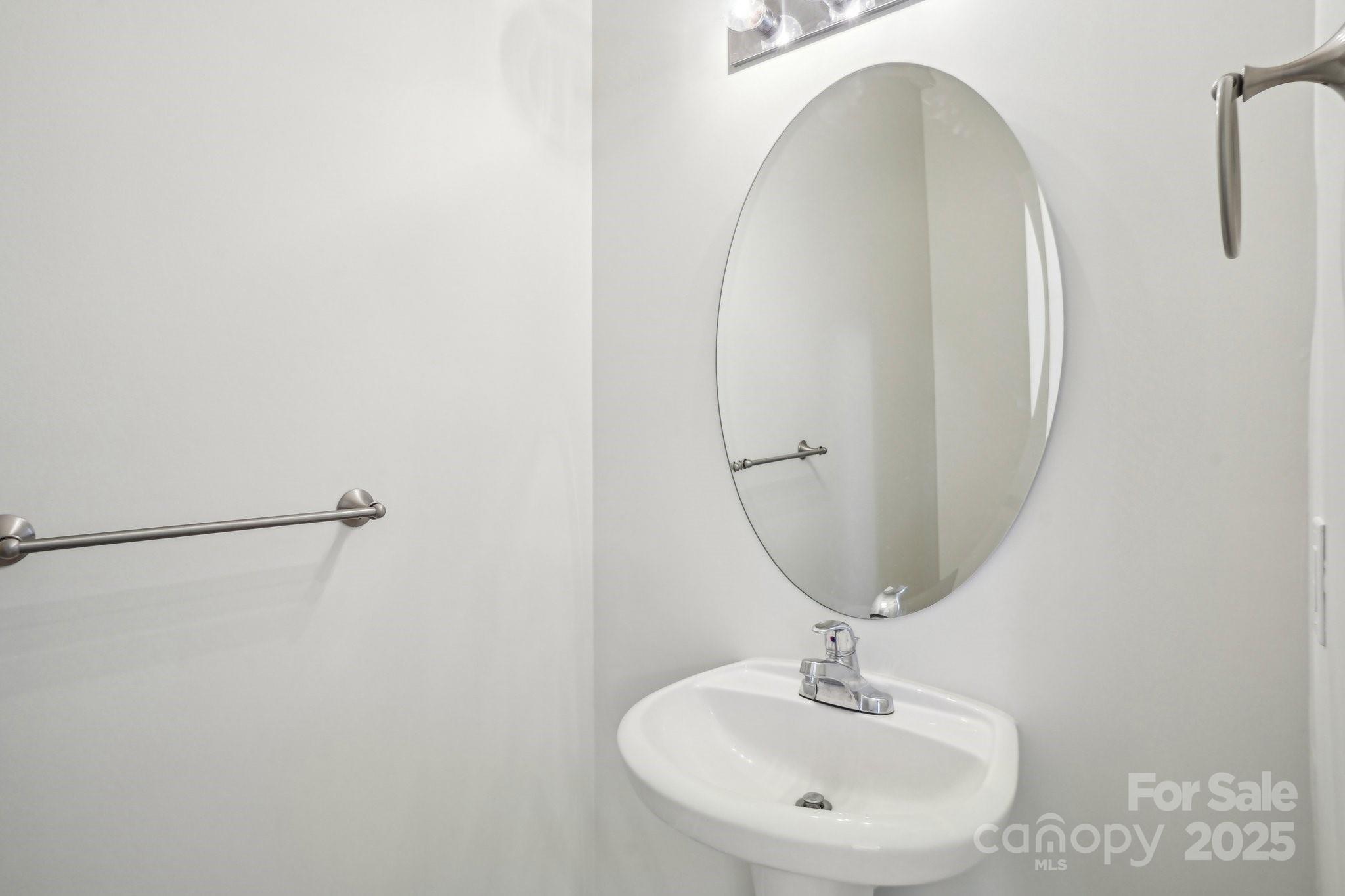 127 High Ridge Road Mooresville, NC 28117 - Photo 11 of 34 a bathroom with a sink and a mirror