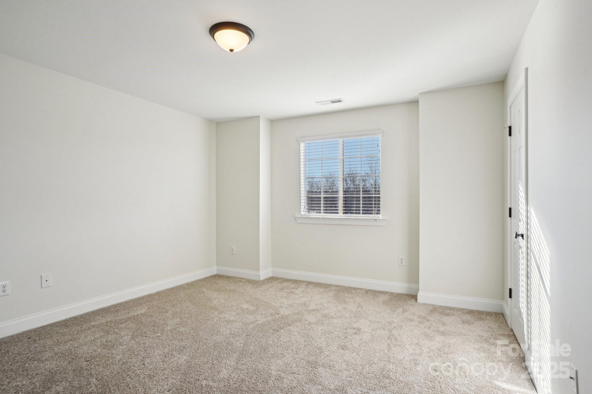 127 High Ridge Road Mooresville, NC 28117 - Photo 13 of 34 an empty room with windows