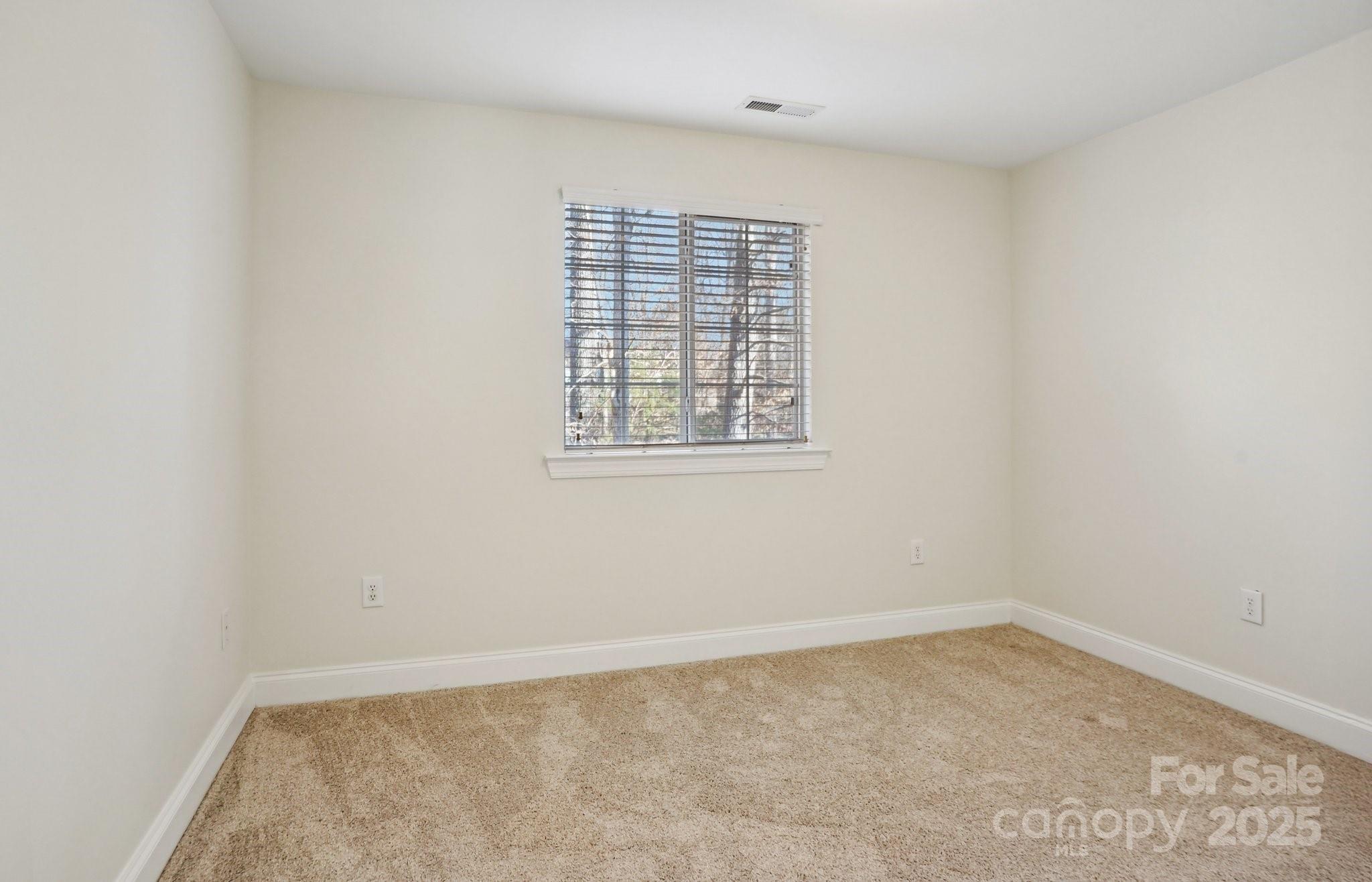 127 High Ridge Road Mooresville, NC 28117 - Photo 14 of 34 an empty room with a window