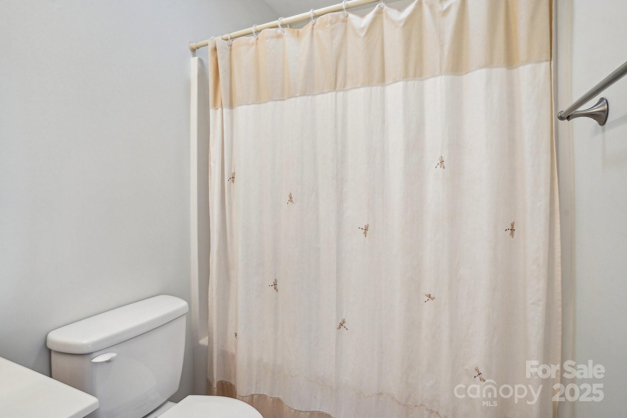 127 High Ridge Road Mooresville, NC 28117 - Photo 17 of 34 a white toilet sitting next to a shower