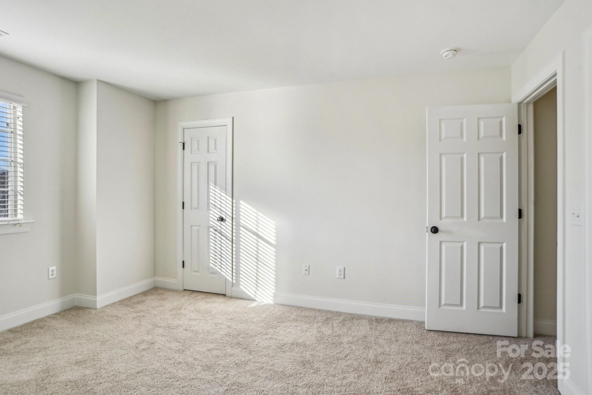 127 High Ridge Road Mooresville, NC 28117 - Photo 18 of 34 an empty room with windows