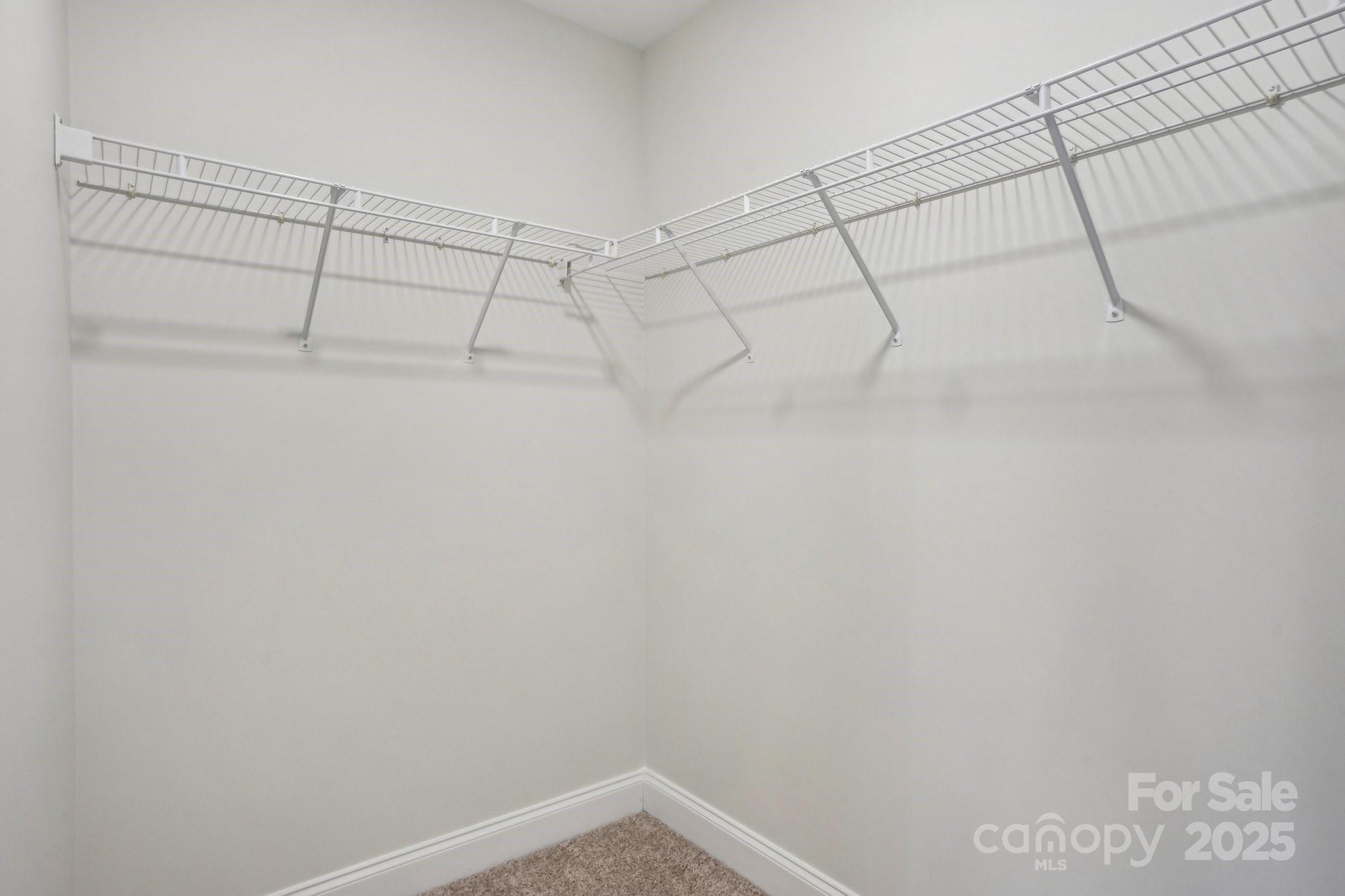 127 High Ridge Road Mooresville, NC 28117 - Photo 20 of 34 a view of a room with racks on the wall