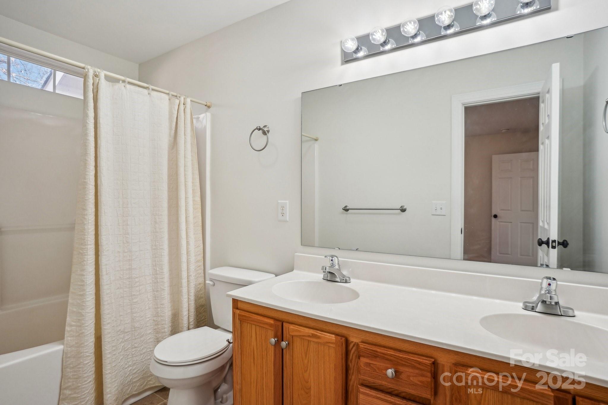 127 High Ridge Road Mooresville, NC 28117 - Photo 21 of 34 a bathroom with a granite countertop sink toilet and shower