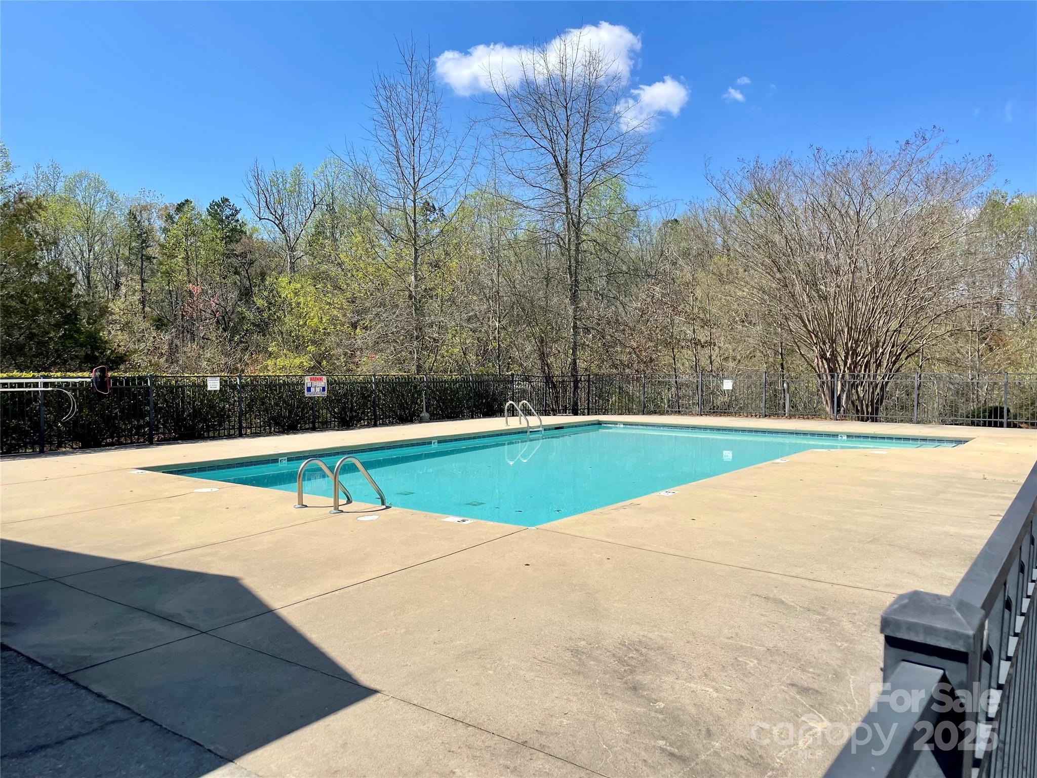 127 High Ridge Road Mooresville, NC 28117 - Photo 28 of 34 a view of a swimming pool with a yard