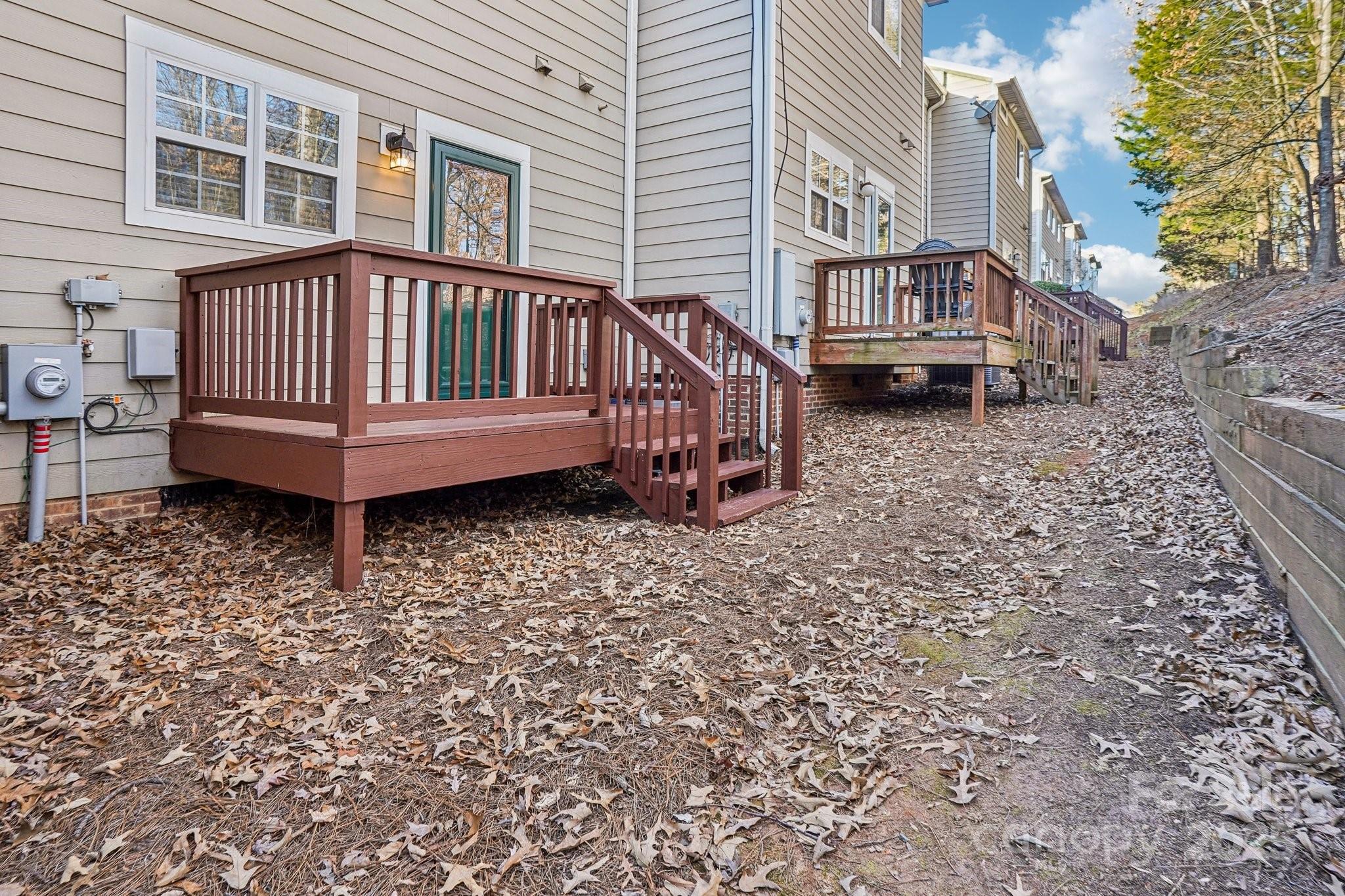 127 High Ridge Road Mooresville, NC 28117 - Photo 33 of 34 a view of a house with a yard and deck