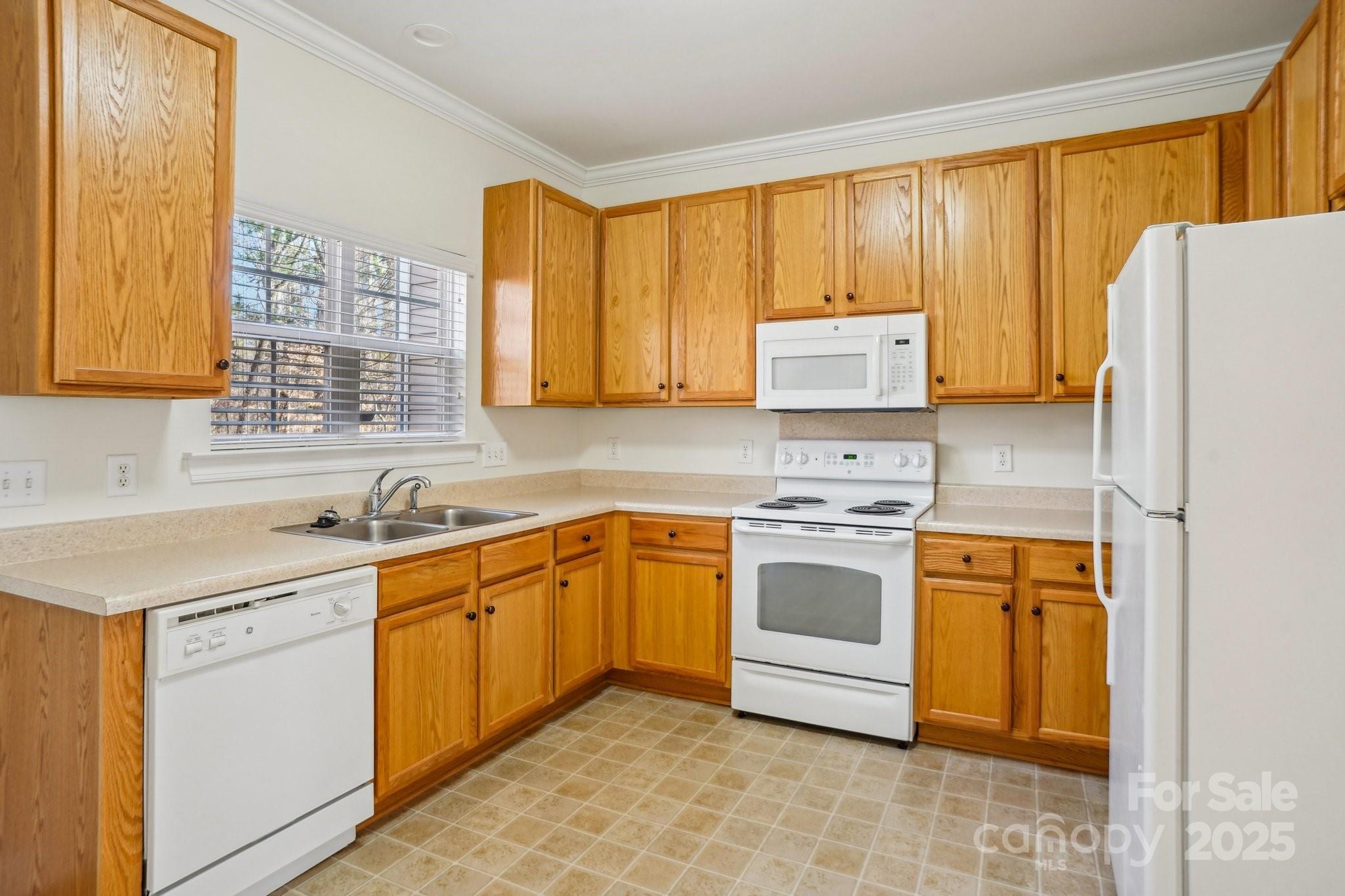 127 High Ridge Road Mooresville, NC 28117 - Photo 9 of 34 a kitchen with a sink stove and refrigerator
