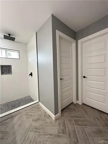 a bathroom with double sink and a mirror