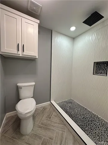 a spacious bathroom with a double vanity sink and a mirror