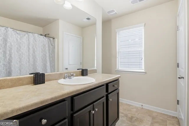 a view of a bathroom from a hallway