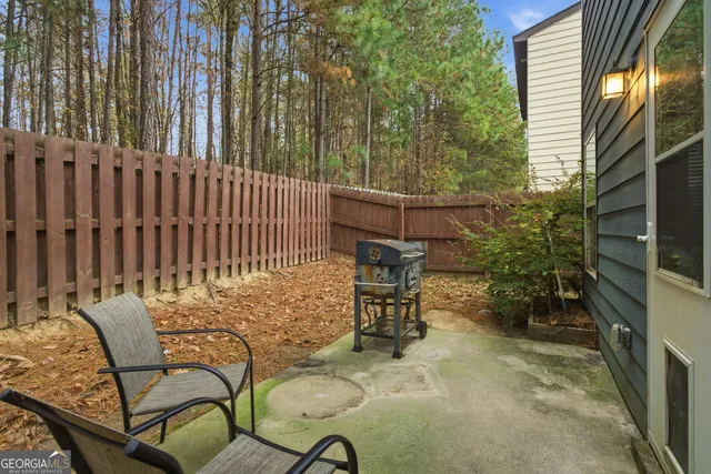 a backyard of a house with outdoor seating