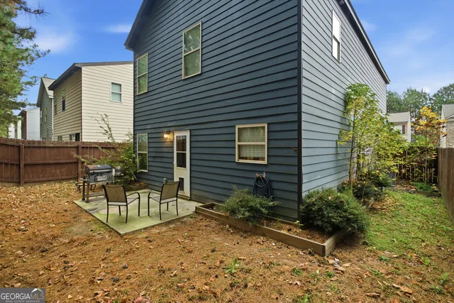 a house view with a sitting space and garden