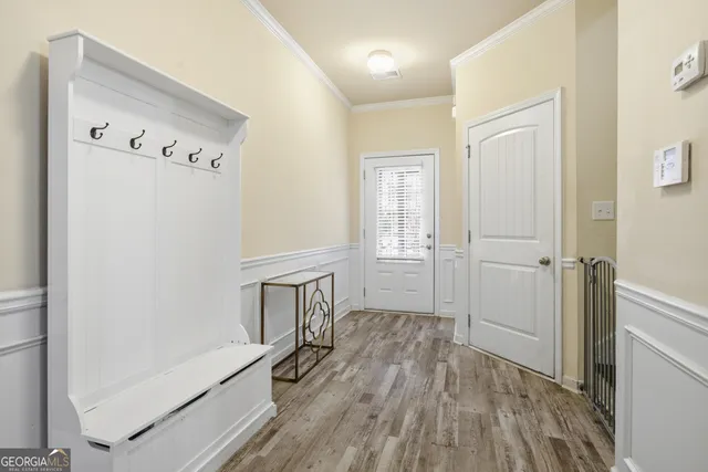 a bathroom with a sink toilet and a mirror