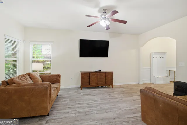 a kitchen with stainless steel appliances a refrigerator sink and microwave