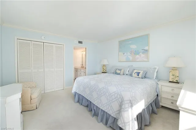 a spacious bedroom with a bed and a window