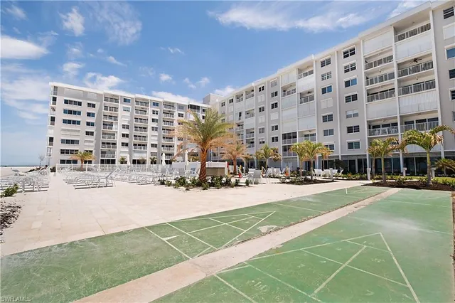 a view of a swimming pool with a yard