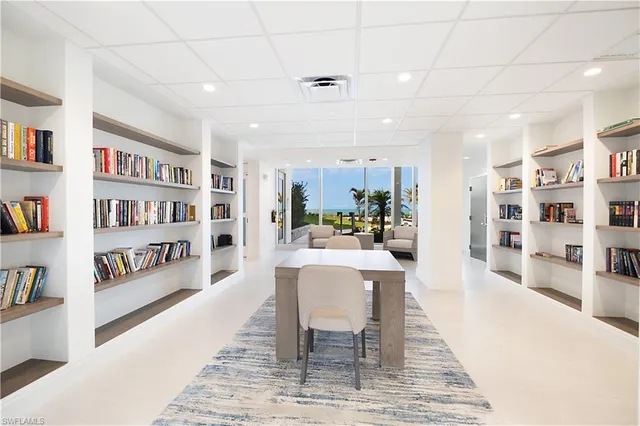 a room with gym equipment and large mirror