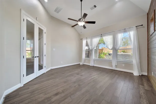 a view of an empty room with a window