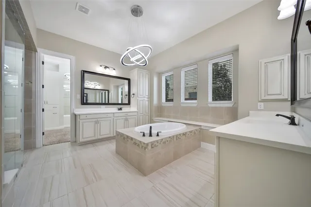 a bathroom with a glass shower door