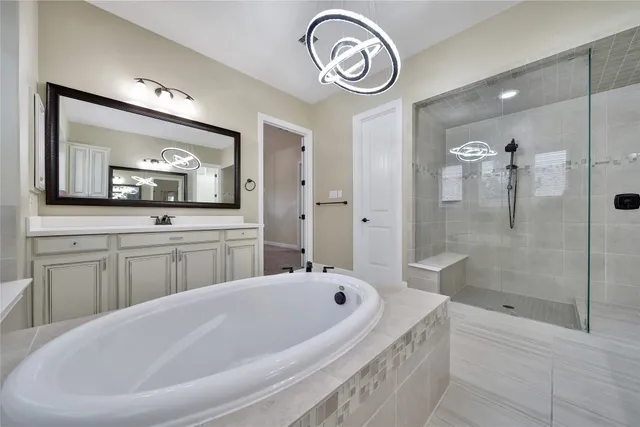a bathroom with a bathtub and a sink