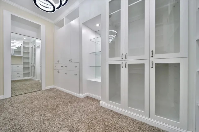 a view of a storage and utility room with closet