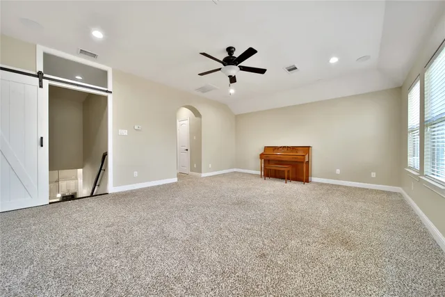 a view of an empty room with a fireplace