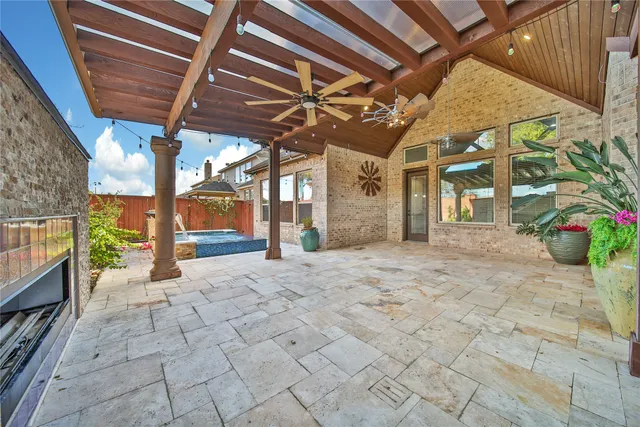 a view of a swimming pool with a patio