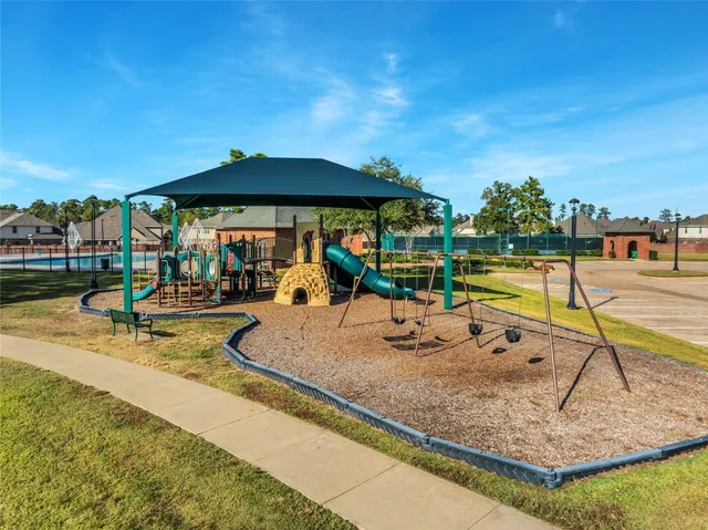 a view of swimming pool with outdoor seating and city view