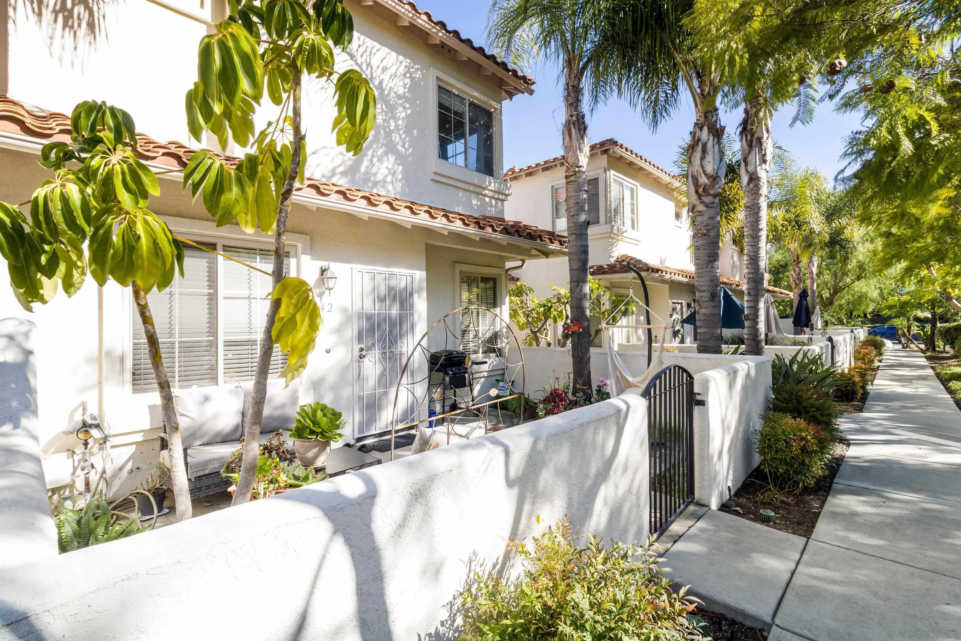 4046 Craven Road, Unit 42 Oceanside, CA 92057 - Photo 2 of 17 a view of a house with a swimming pool