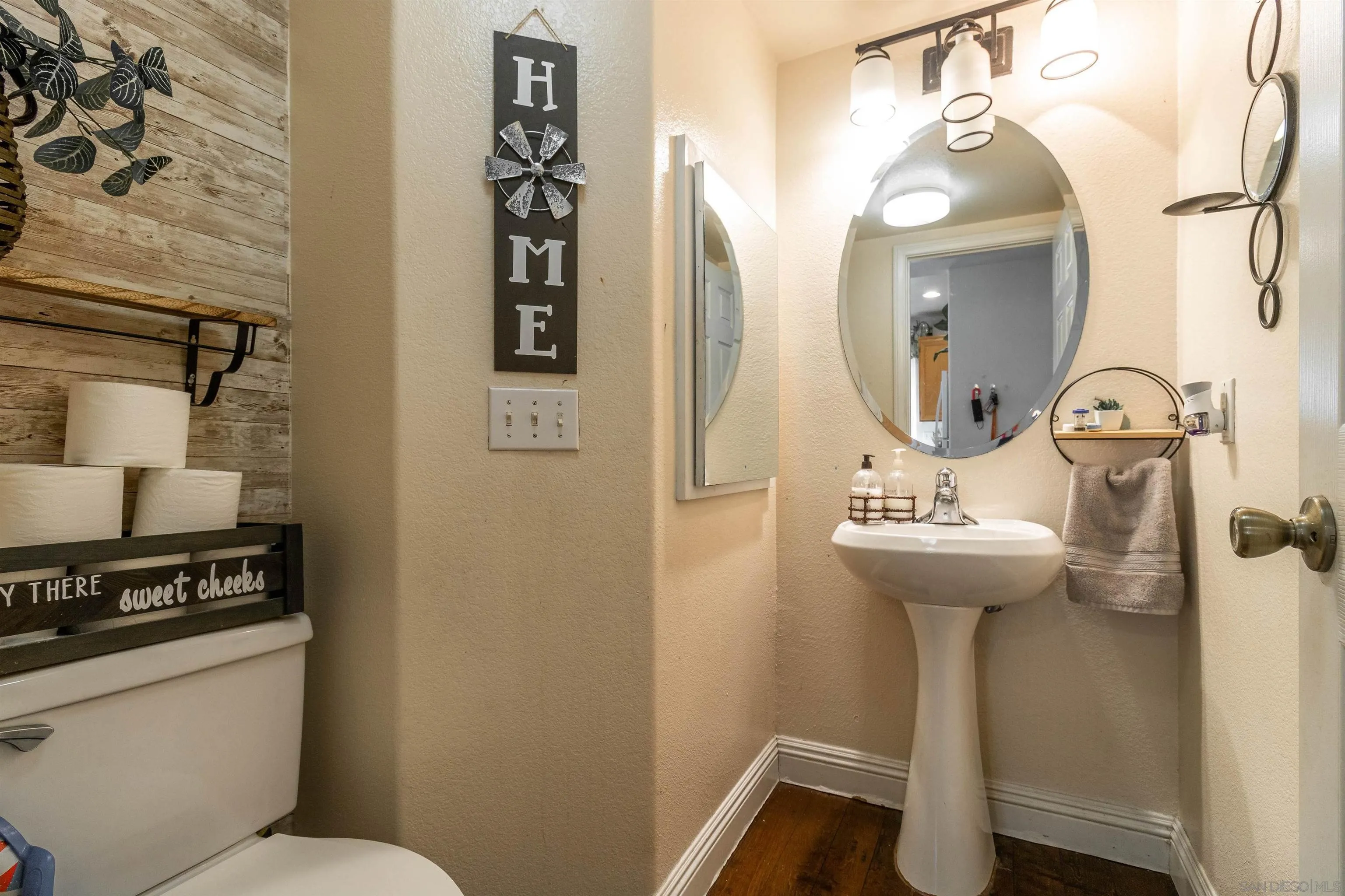 4046 Craven Road, Unit 42 Oceanside, CA 92057 - Photo 8 of 17 a bathroom with a sink toilet and mirror