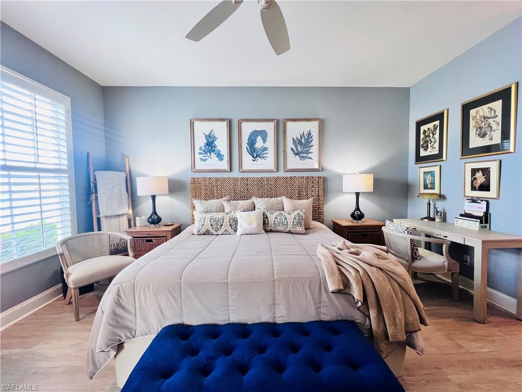 3250 West Crown Pointe Boulevard, Unit 101 Naples, FL 34112 - Photo 13 of 46 a bedroom with bed and a window