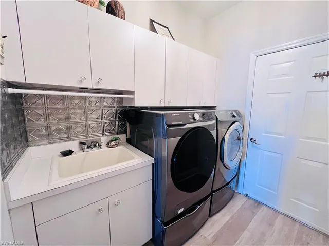 a utility room with dryer and washer