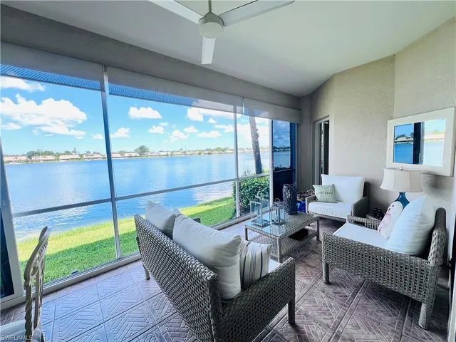 a living room with patio filled with furniture